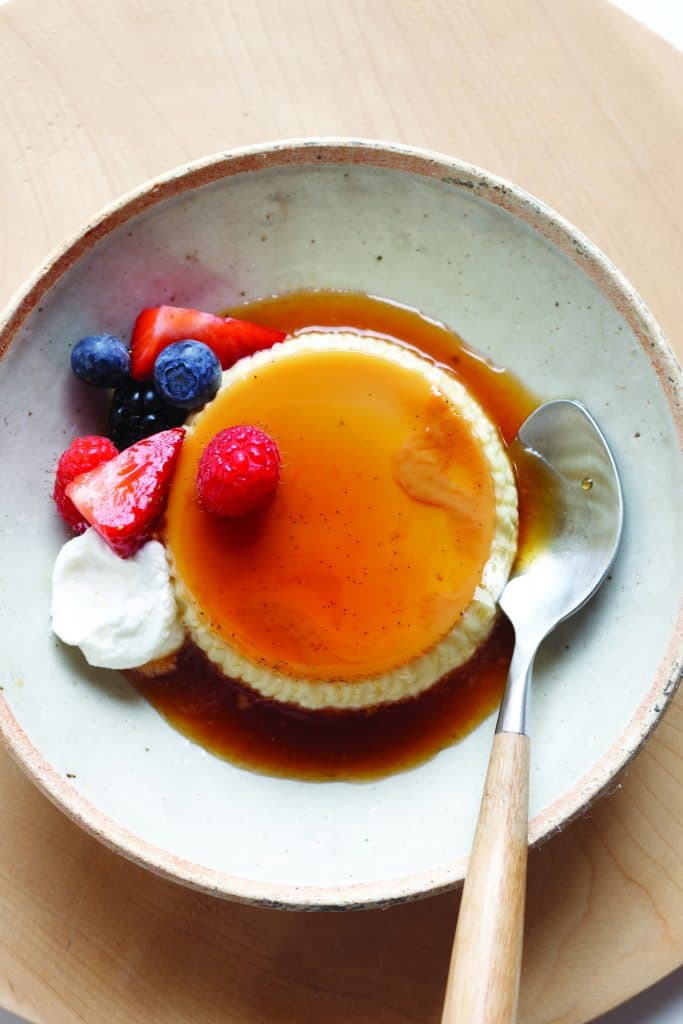 vanilla bean flan topped with fruits