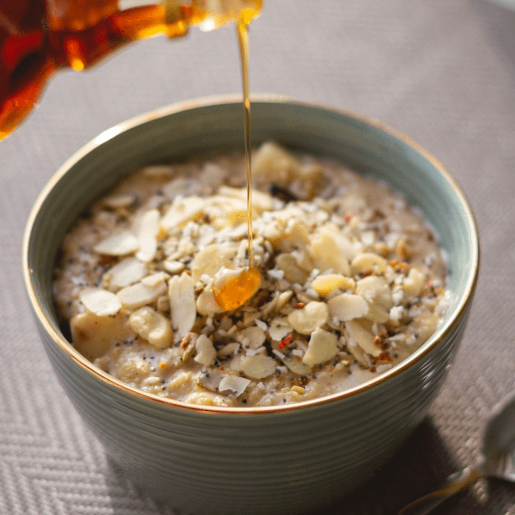 oats and lentils in a bowl with drizzled syrup